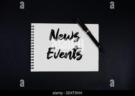News Events text written on notepad Stock Photo