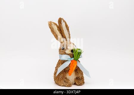 Decorative Bunny with carrot on white background Stock Photo