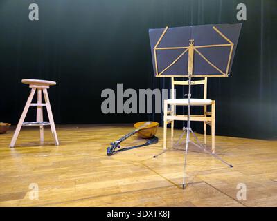 A handcrafted calascione, a traditional Neapolitan instrument, placed on the stage floor waiting to be played. Stock Photo