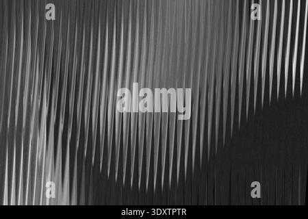 Abstract monochrome image featuring a blurred and flowing pattern with subtle gradations of light and shadow Stock Photo