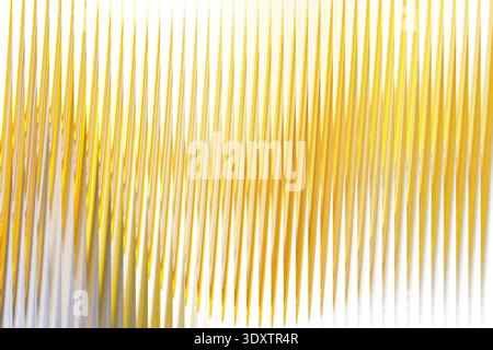 Abstract blurred yellow and white background with soft flowing lines creating a dynamic composition Stock Photo