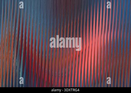 Abstract background featuring a blend of red blue and dark tones creating a dynamic composition Stock Photo