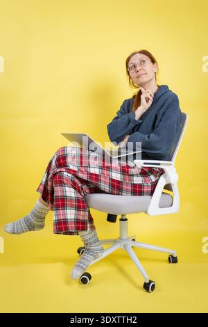 Woman working from home thinking about new ideas Stock Photo