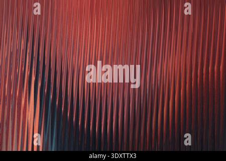 Abstract blurred background with shades of red orange brown and dark blue creating a soft effect Stock Photo