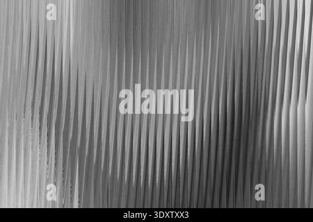 Abstract grayscale image featuring blurred and textured patterns with subtle light variations and gradients Stock Photo