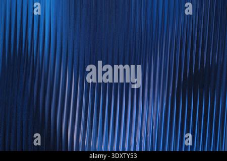 A blurry abstract background with shades of dark blue and light blue creating a smooth gradient effect Stock Photo