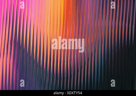 Abstract background showing a blend of vibrant colors including pink orange red and dark shades of blue Stock Photo