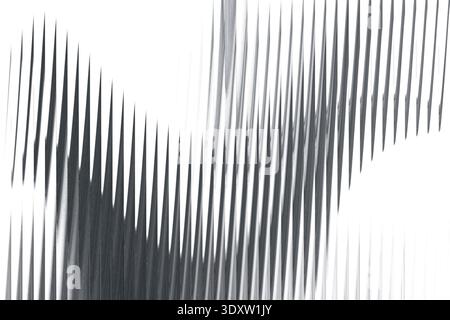 A grayscale abstract image featuring a blurred and distorted shape against a white background creating contrast Stock Photo