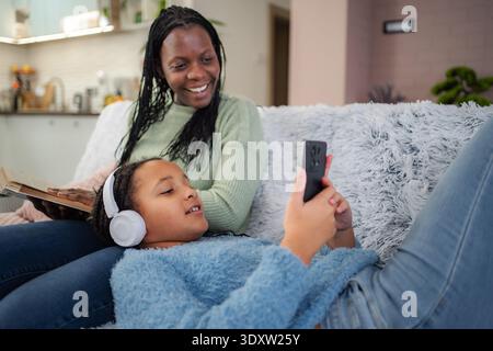 Enjoying quality time together at home with laughter and a cozy atmosphere on a relaxing afternoon Stock Photo