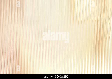 An abstract close up view of soft beige and light brown fabric with subtle folds and gentle curves Stock Photo