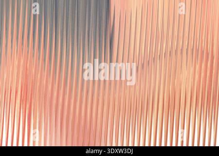 A close up view of soft pink and blue fabric with a smooth and flowing texture in a blurred style Stock Photo