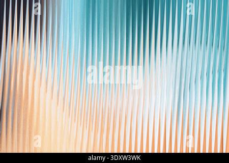 Abstract blurred gradient of colors blending from teal to tan with dark shadow on the side view Stock Photo