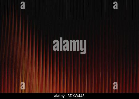 A blurry dark background with a gradient of red and brown colors at the bottom of the frame visible Stock Photo