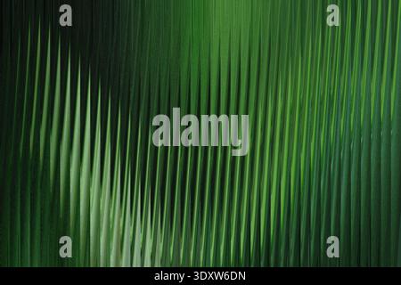 A blurry image showcasing shades of green with soft light creating an abstract natural background look Stock Photo
