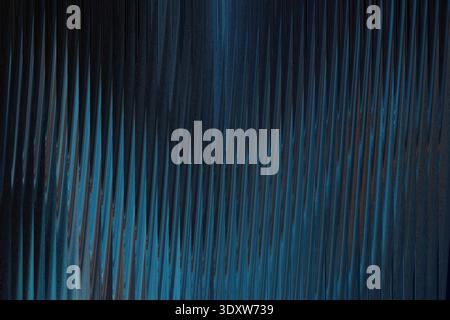 Abstract blue and black background with vertical light streak and blurred color transitions creating depth Stock Photo