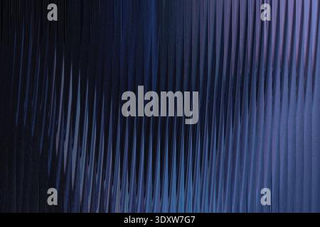 Abstract blue and black gradient background with blurred vertical lines creating a smooth transition Stock Photo