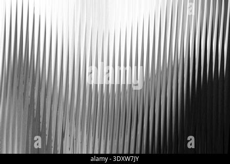 Abstract grayscale image featuring blurred vertical lines and soft gradient transitions in monochrome Stock Photo