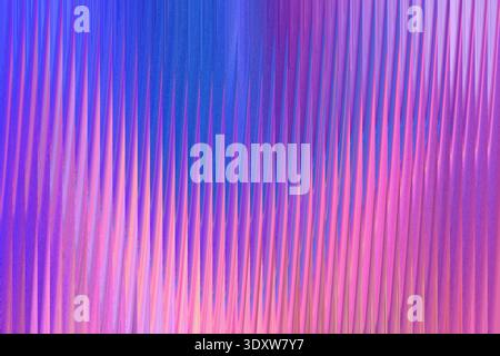 An abstract background showing blurred vertical streaks of purple pink and blue color gradients softly blended Stock Photo