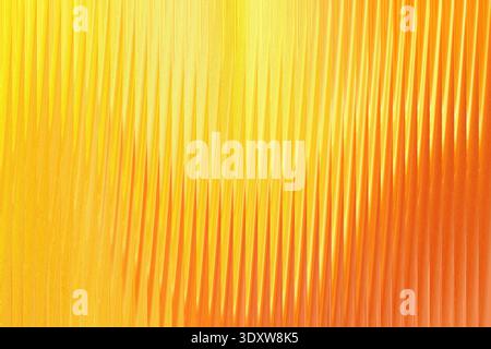 A blurred background showcasing a gradient of orange hues transitioning from light to slightly darker shades Stock Photo
