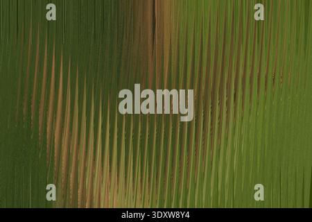 Abstract blurred background featuring shades of green and brown with a vertical gradient effect Stock Photo