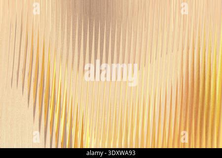 A textured beige background features soft, blurred shadows creating an abstract and subtly patterned surface Stock Photo