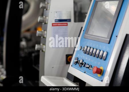 Control panel of modern automated woodworking machine. Selective focus. Stock Photo