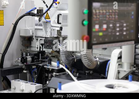 Part of modern automatic edge bander machine with control console. Selective focus. Stock Photo