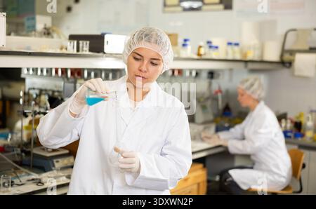 Portrait of young woman lab technician working Stock Photo