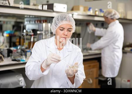 Portrait of young woman lab technician working Stock Photo