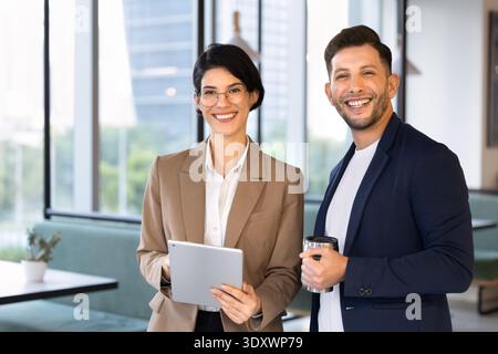 Colleagues posing for corporate portrait during break in coworking office Stock Photo