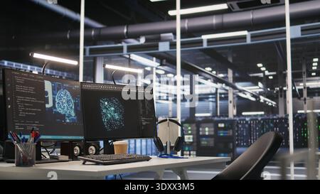 AI development workstation in data center with dual monitors displaying machine learning code. Server hub computers used for tracking neural network structures algorithm performance Stock Photo