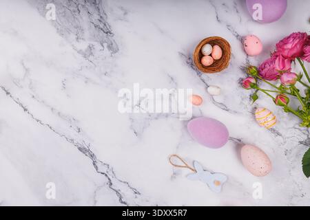 Pastel Easter Flat Lay with Eggs and Roses Stock Photo