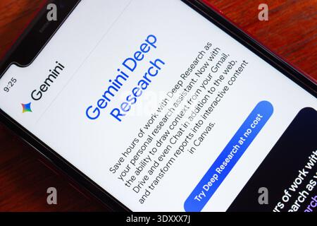 Smartphone screen showing Gemini Deep Research interface, an AI-powered tool for advanced content analysis and contextual research support. Stock Photo