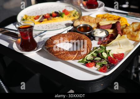 Breakfast spread with tea and various dishes on table Stock Photo