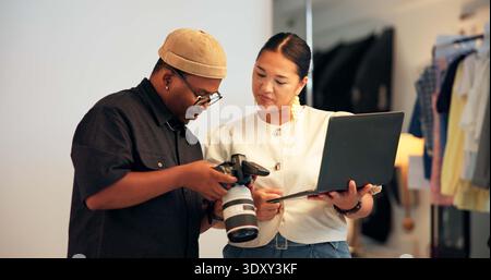 Creative, people and photographer in studio with laptop, camera or partnership for media project review. Photography, team and collaboration on set Stock Photo