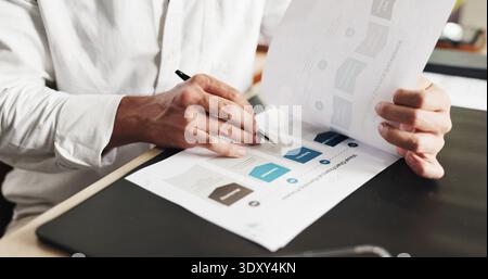 Writing, documents and hand of businessperson with charts in office for research on finance report. Paperwork, planning and financial manager with Stock Photo
