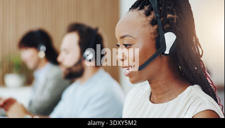 Call center, happy and businesswoman with headset in office with consultation, crm or helpdesk. Talk, communication and female technical support Stock Photo