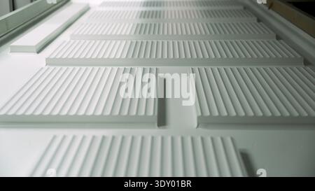 White architectural detail with grooved texture and repeating lines. Minimalist abstract background concept. Stock Photo