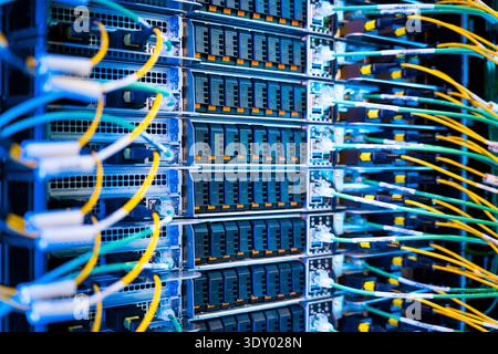 close up of server racks in a data center used for ai with cables and plugs. Concept of hardware and connectivity for AI computing center Stock Photo