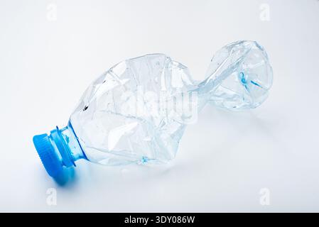 Crumpled plastic bottle on a white background Stock Photo