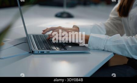Unrecognizable business woman typing laptop in office businesswoman working computer online female girl work with internet software cyberspace at Stock Photo