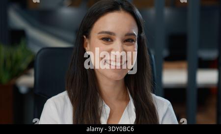 Portrait Caucasian business woman smiling looking at camera working in marketing company office European businesswoman smile cheerful girl joyful Stock Photo