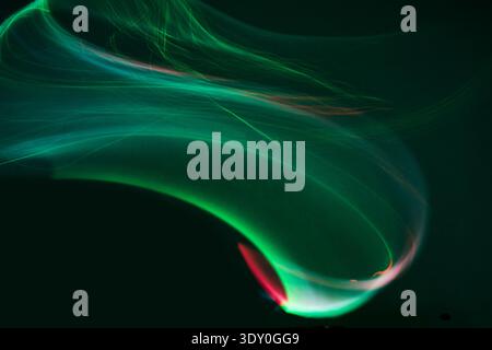 Abstract green light streaks creating dynamic energy wave Stock Photo