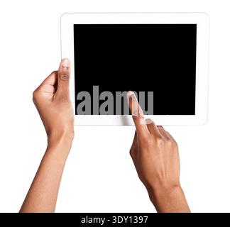 Holding and pointing to blank screen on tablet Stock Photo