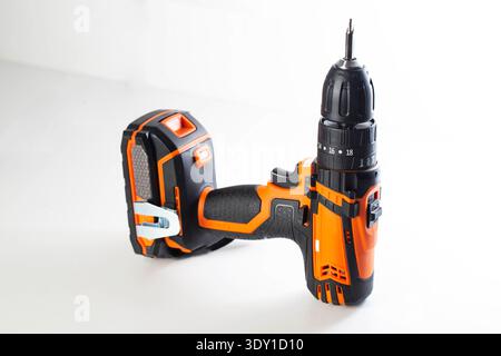Cordless power drill with screwdriver bit on white background. Tool for home improvement, construction, DIY projects. Stock Photo