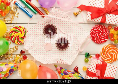 Tasty chocolate cakes and lots of birthday party decorations Stock Photo