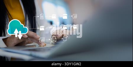 Businesswoman using laptop for cloud computing technology and digital document management system, online data storage, and efficient workflow automati Stock Photo