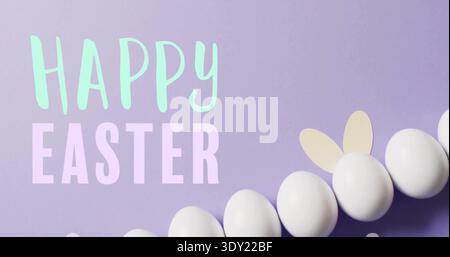 Displaying white eggs with bunny ears on pastel lavender flat-lay, showing HAPPY EASTER letters. Minimal, typography, card, banner, row, ovals, shadow Stock Photo
