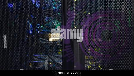 Displaying server rack cabinet showing perforated door, handle in data center, with purple decal. Cables, mesh, leds, network, equipment, lighting, in Stock Photo