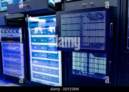 close up of server racks in a data center used for ai with cables and plugs. Concept of hardware and connectivity for AI computing center Stock Photo